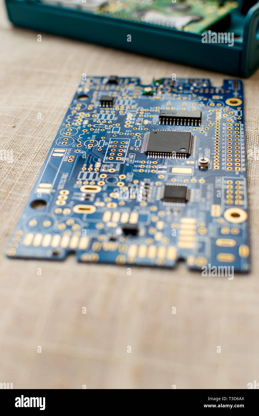 Circuitboard with resistors microchips and smd electronic components - selective focus Stock Photo