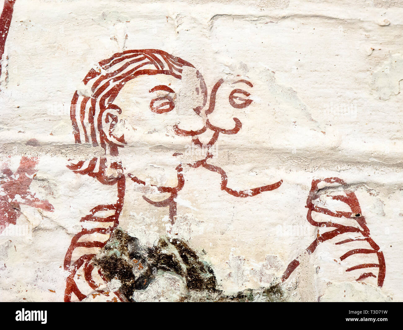Man and woman tender kissing. Medieval fresco in a Swedish church. One of  the seven deadly sins: Lust. (Luxoria) Sept 03, 2010, Stock Photo