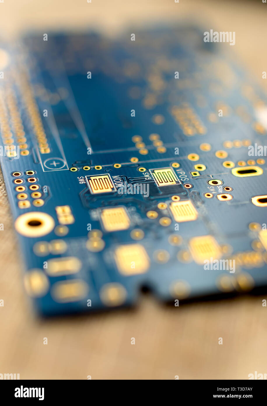 Circuitboard with resistors microchips and smd electronic components - selective focus Stock Photo