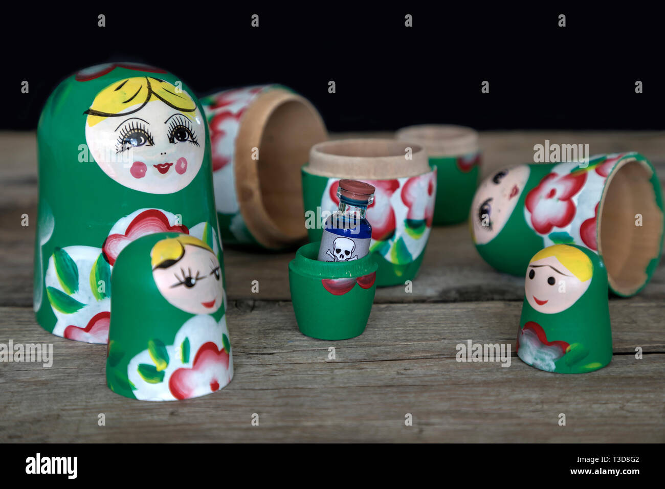A small bottle of poison hidden inside one of the Babushka wooden dolls Stock Photo