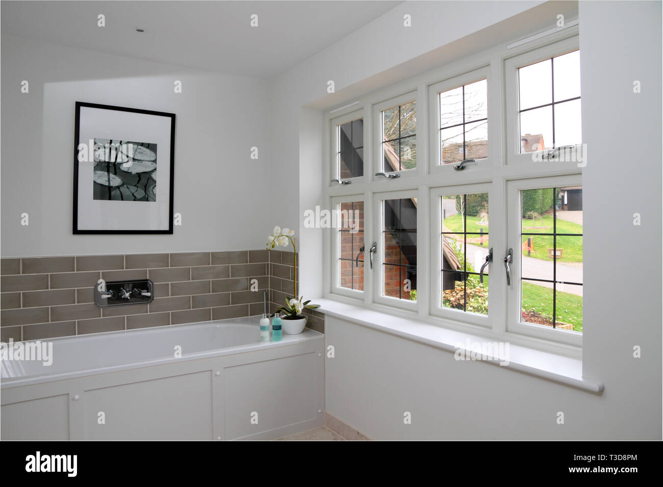 New bathroom with six panel opening wooden windows Stock Photo
