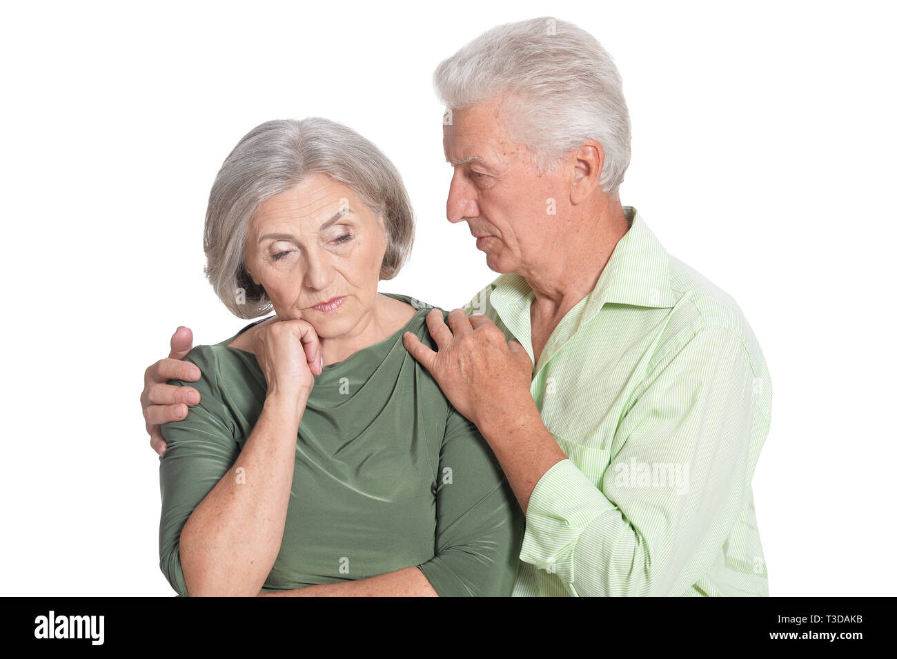 Portrait of sad senior couple on white background Stock Photo