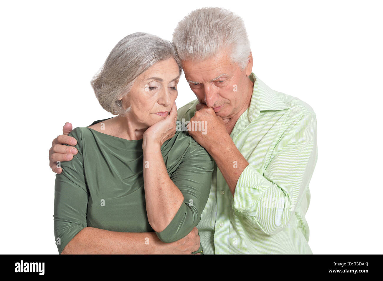 Portrait of sad senior couple on white background Stock Photo