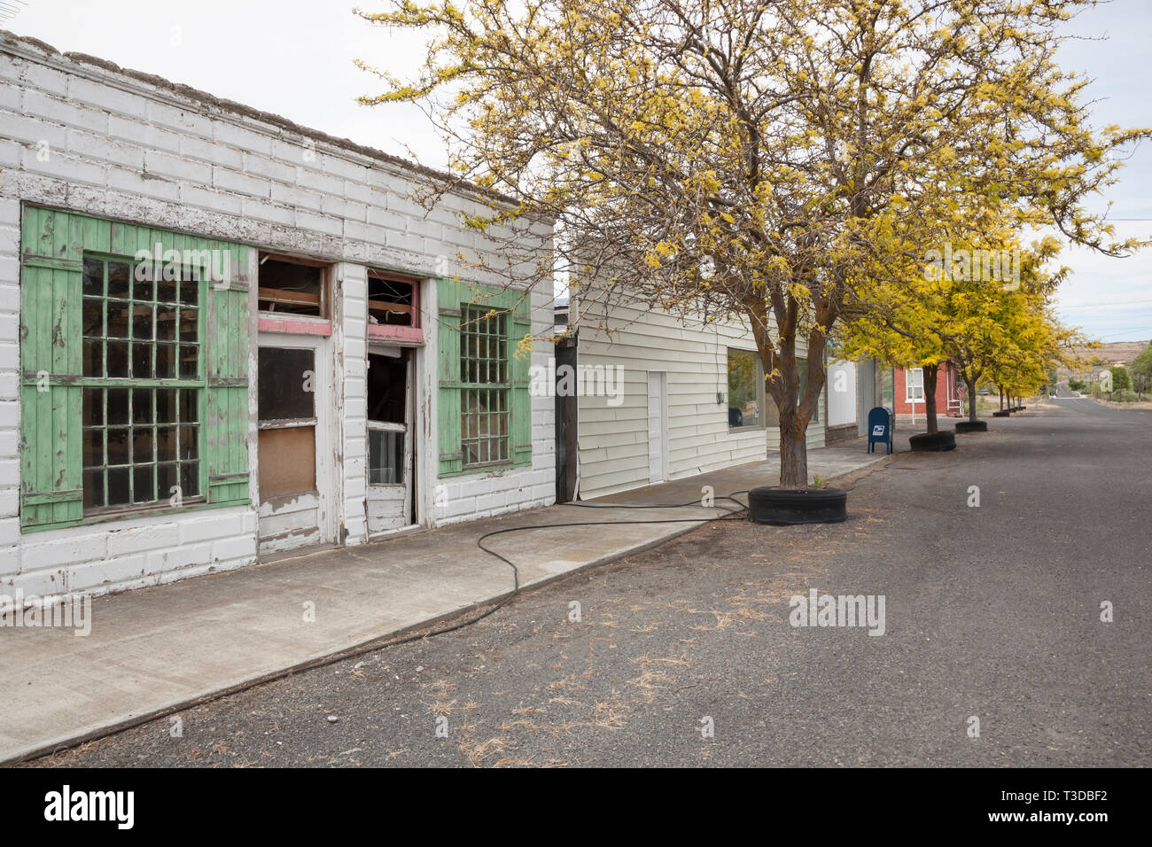 Empty main street and vacant abandoned storefronts in a small town in middle America. Poor economy failed businesses in rural United States. Stock Photo