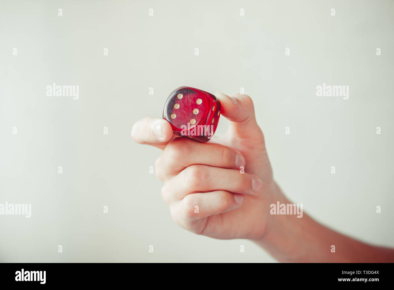 Hand throwing red dices, good luck concept. Stock Photo