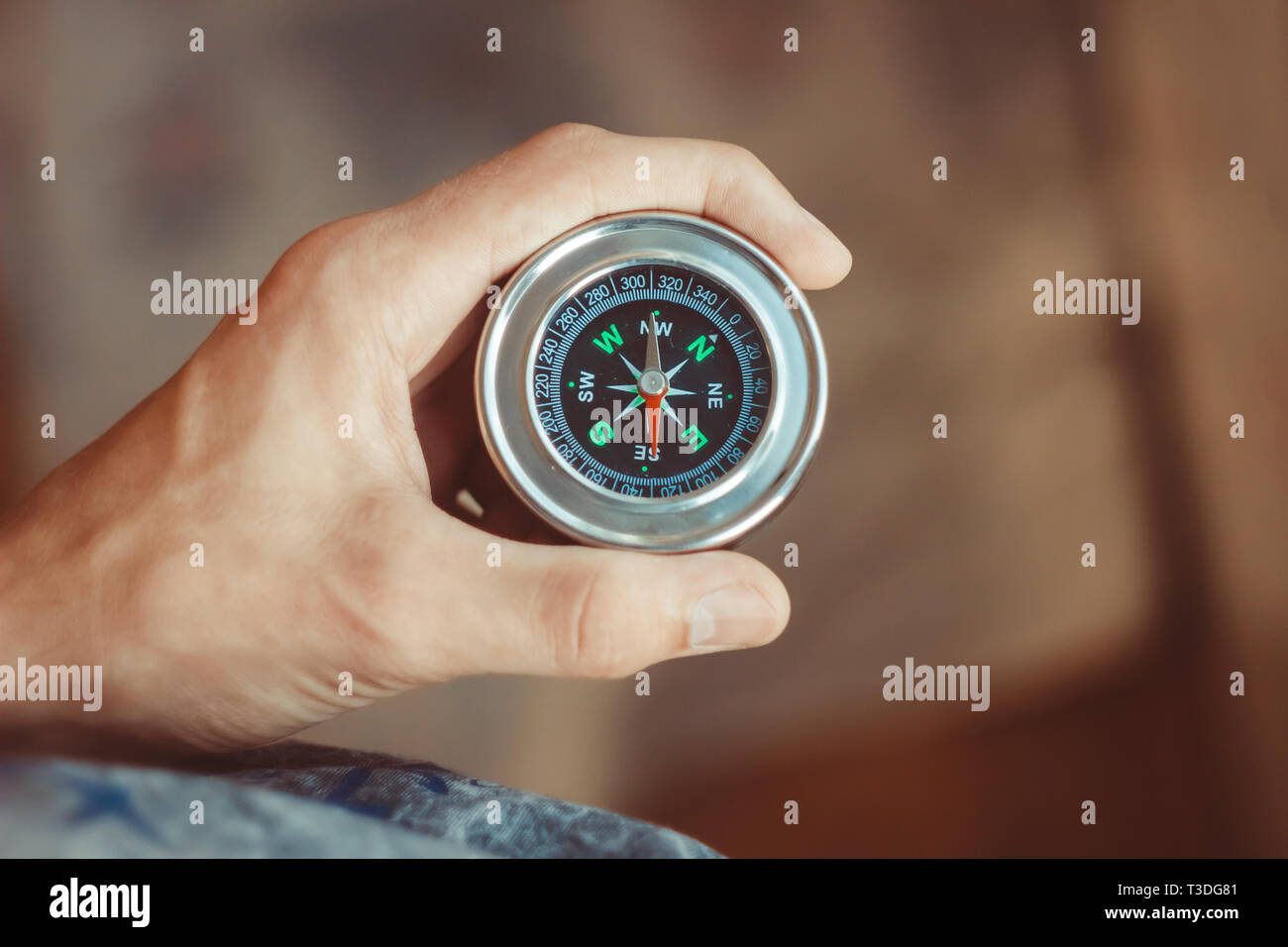 man holding a compass in his hands Stock Photo Alamy