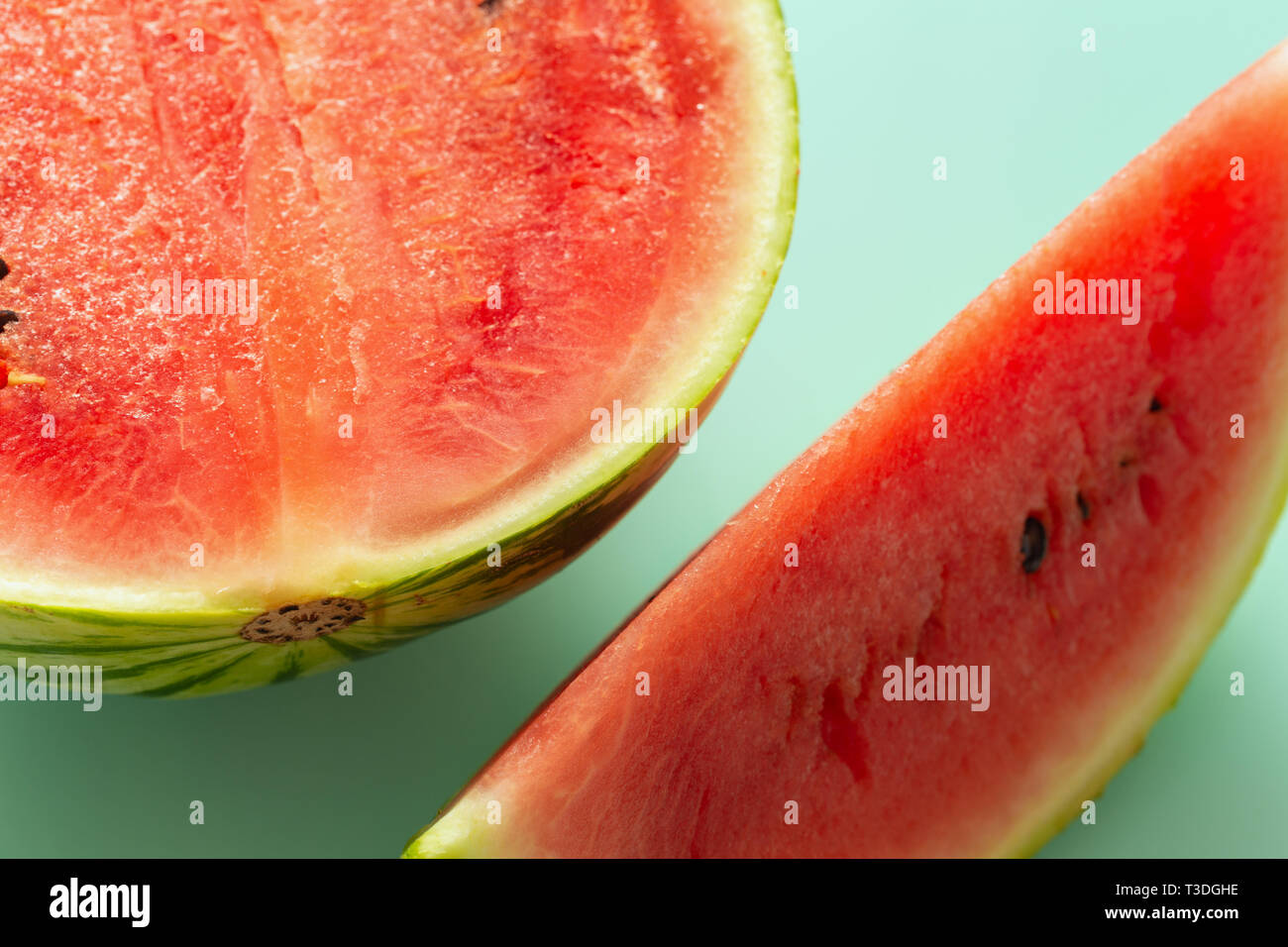 pieces of juicy watermelon on a pastel blue background Stock Photo - Alamy