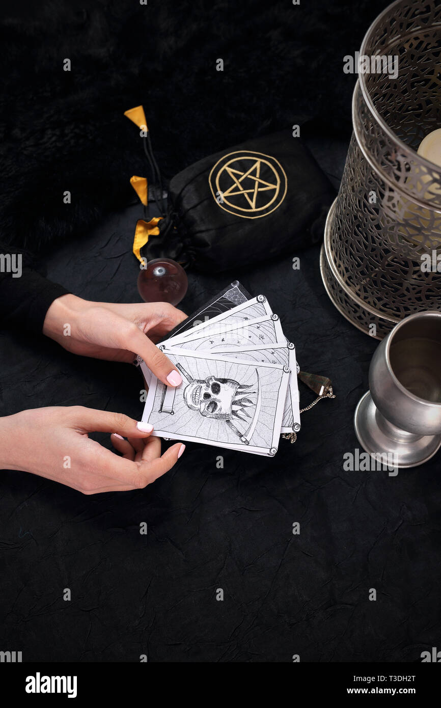 Tarot . The fairy spreads the tarot cards, the magical meaning of the symbols. Stock Photo