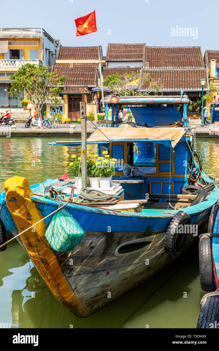 Blue wooden fishing boat with floating fishing baskets moored at Hoi An in  Vietnam South East Asia Stock Photo - Alamy