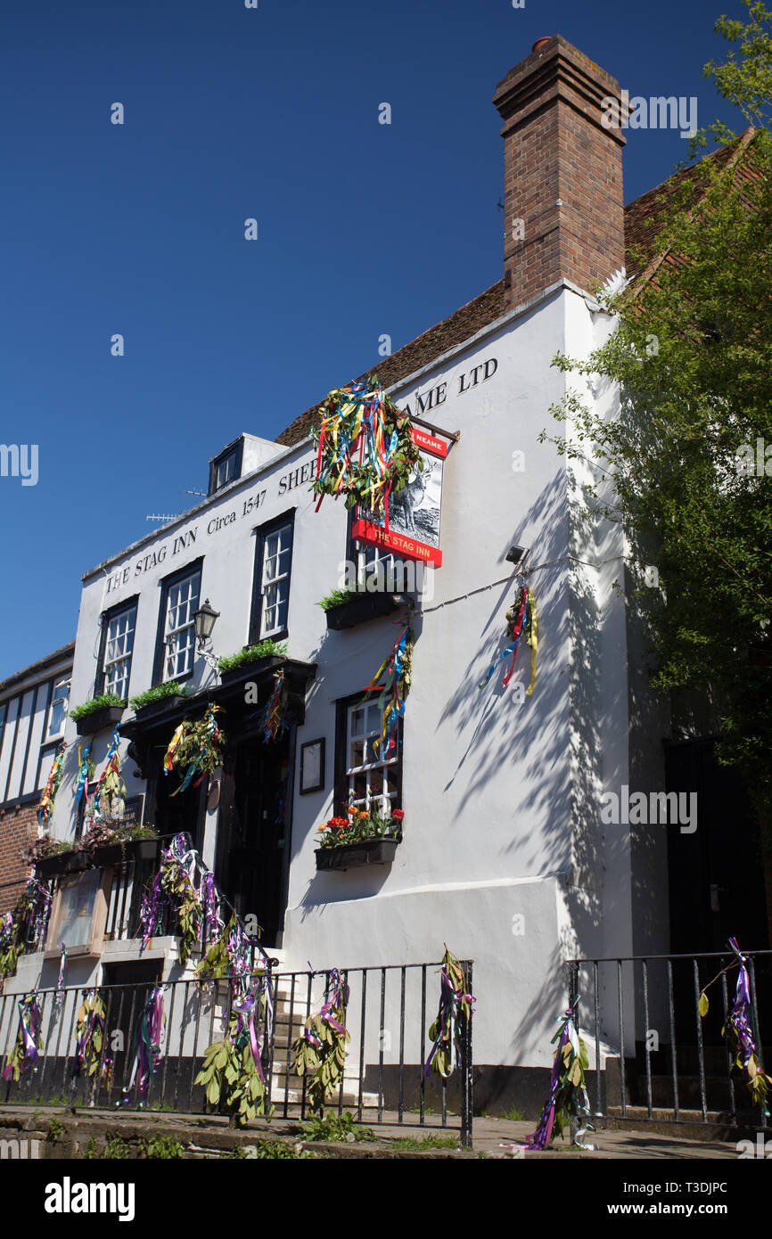 The Stag Inn decorated with colourful ribbons during Jack on the Green celebrations, May Bank weekend Holiday, Hastings Old Town , Sussex, UK Stock Photo