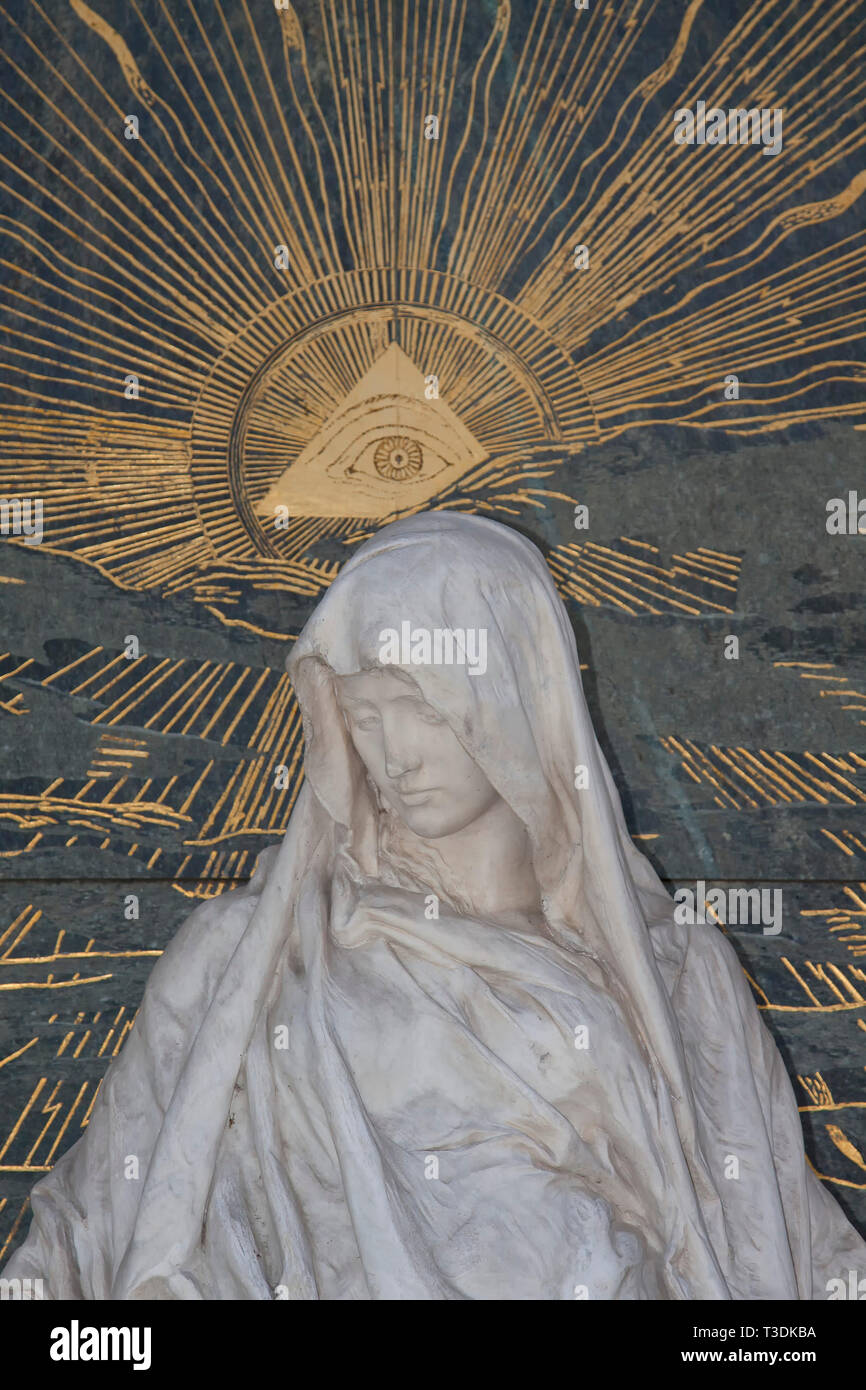 Woman sculpture in front of coffin, in the background God's eye, former ...