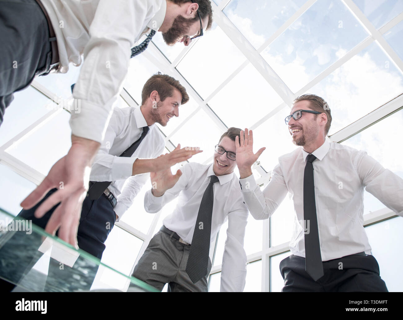 bottom view.happy business team celebrating victory Stock Photo