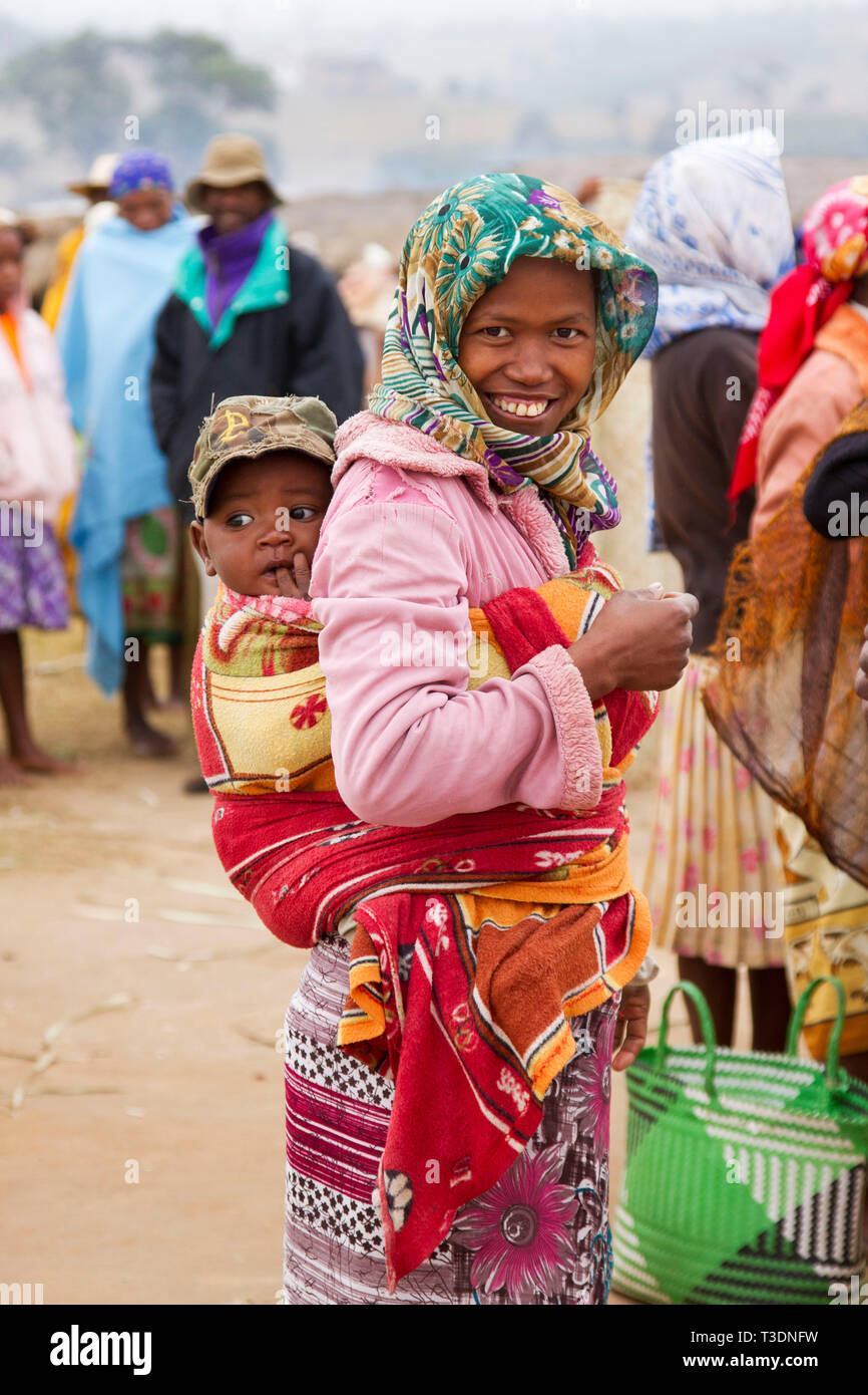 Portrait of Malagasy woman with a child at a farmers market,hill country,Madagascar,Africa Stock Photo