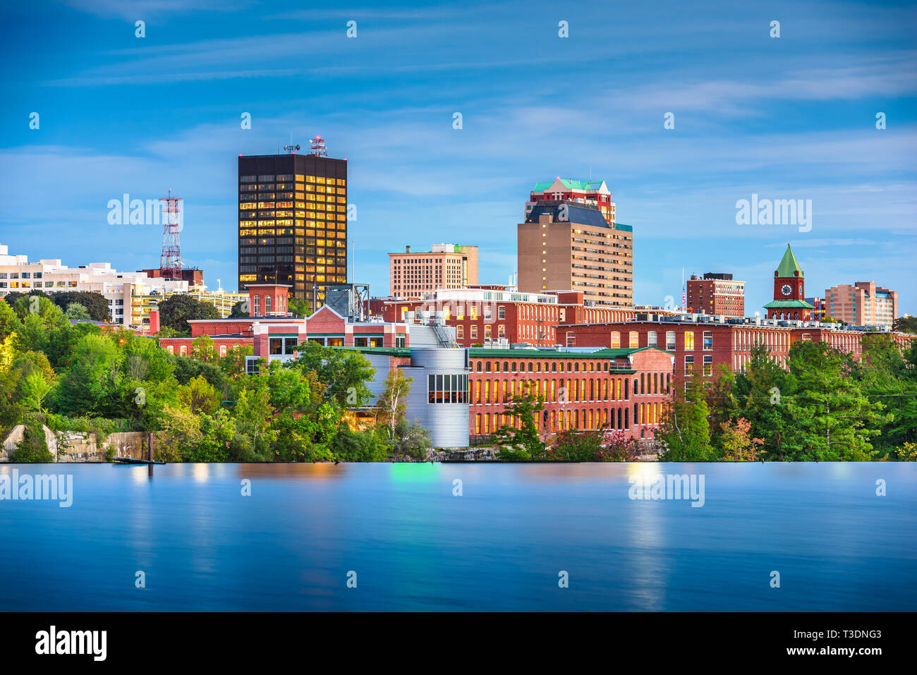 Manchester, New Hampshire, USA Skyline on the Merrimack River at dusk. Stock Photo