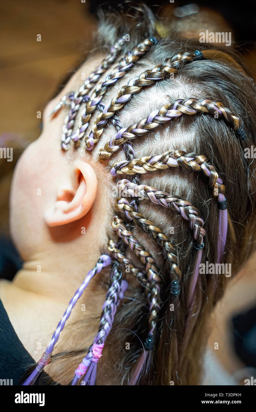 cornrows thin braids on the temple girls, drawings of braids, youth hairstyle for girls Stock Photo