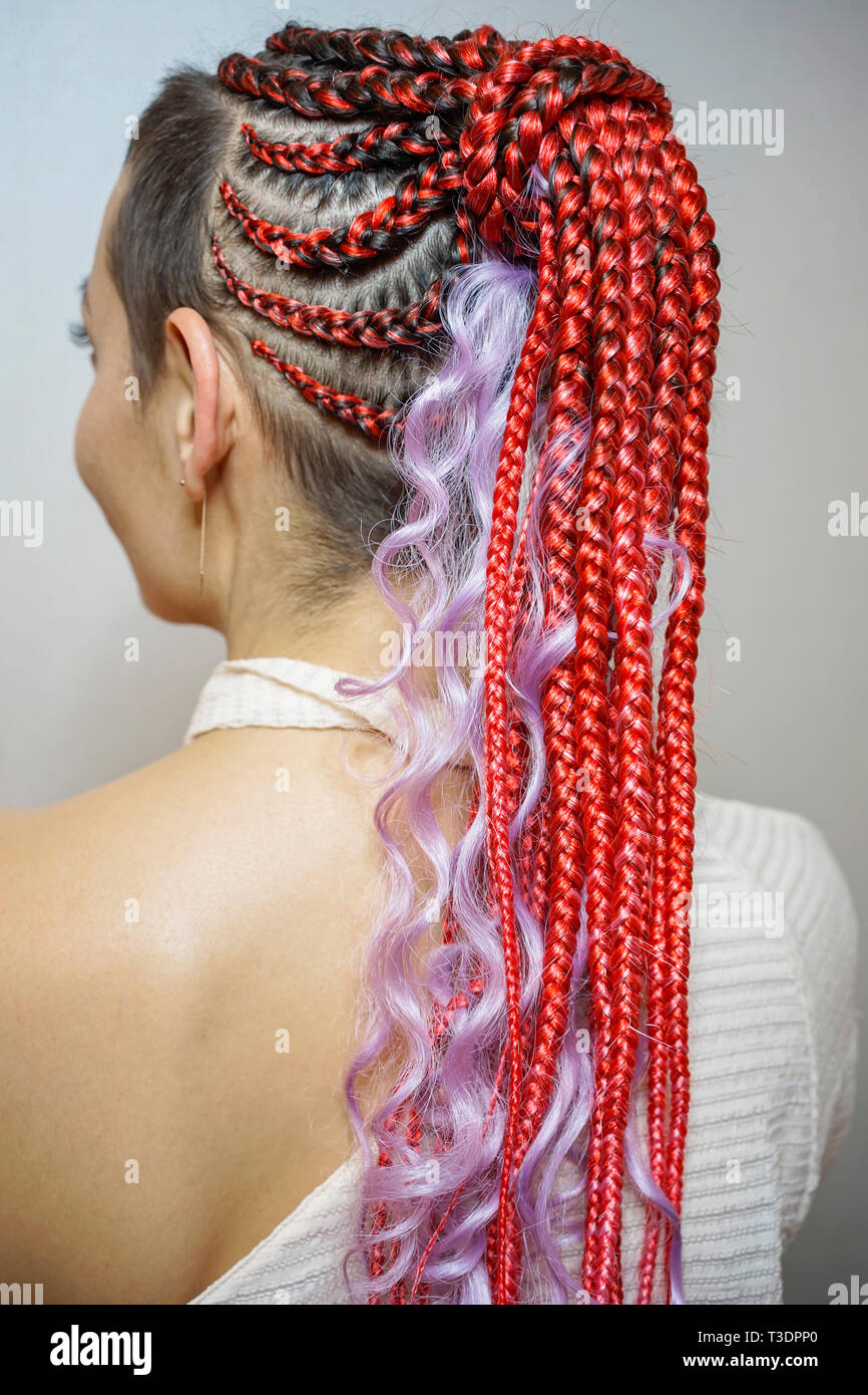 thin African braids woven with crochet, skeleton weaving, French scythes on  the head, hair style in African style, curls, thermal fiber hair extension  Stock Photo - Alamy
