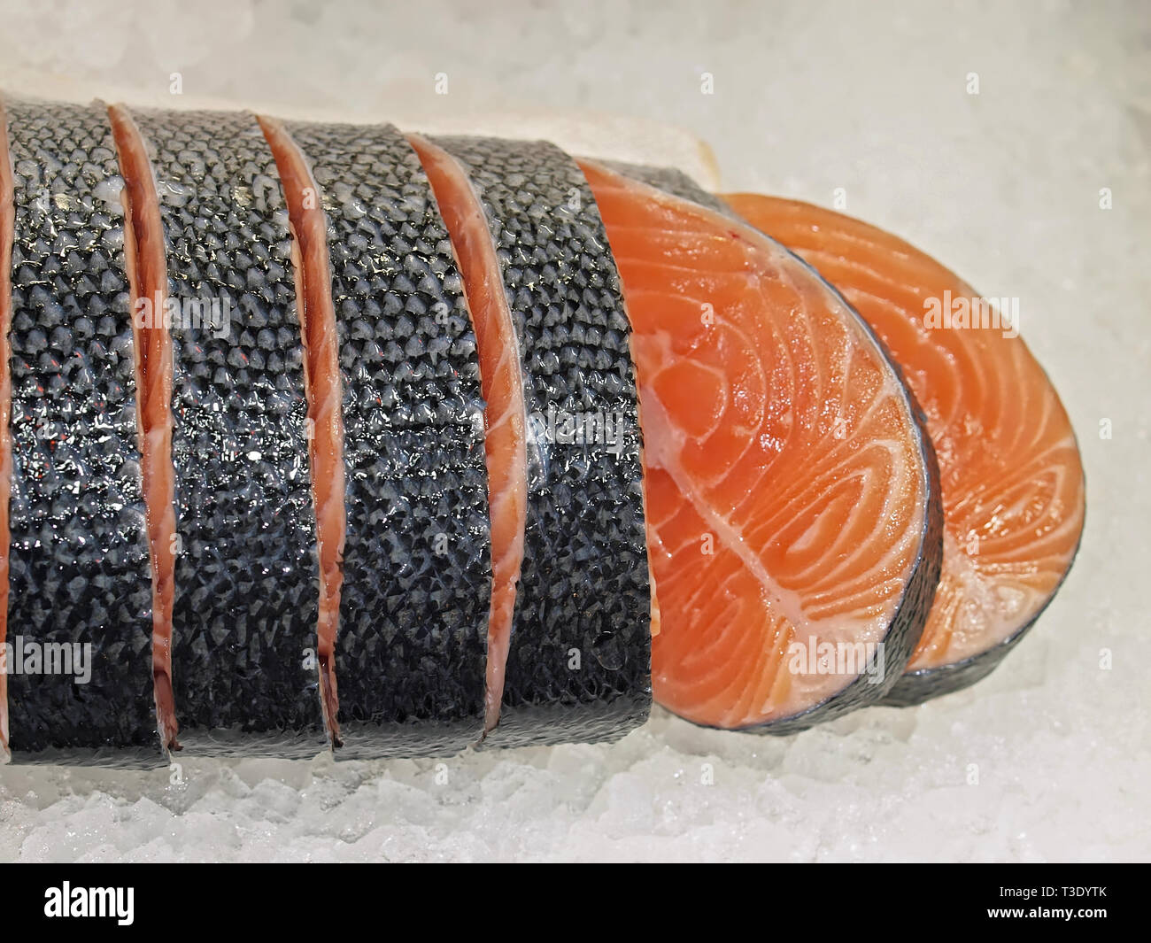 Raw salmon on ice at a fish market Stock Photo - Alamy