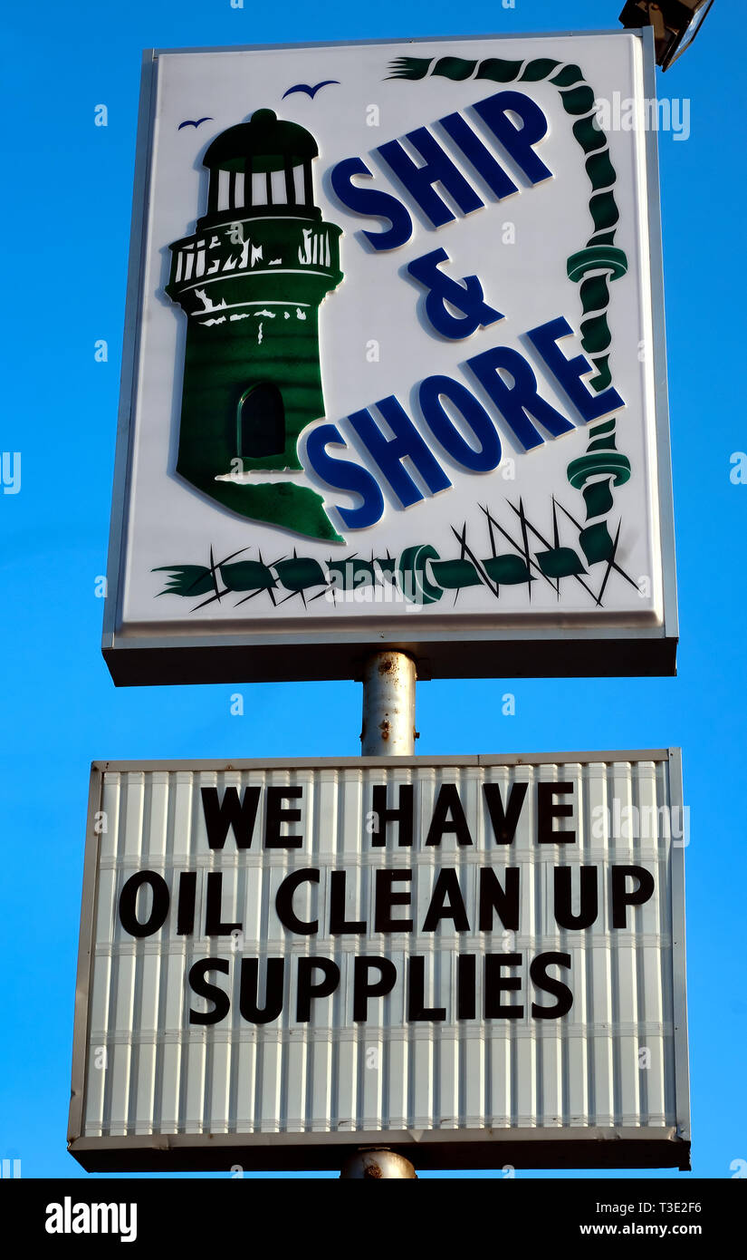 A sign advertises oil cleanup supplies for sale at Ship & Shore in Dauphin Island, Alabama after the BP oil spill. Stock Photo