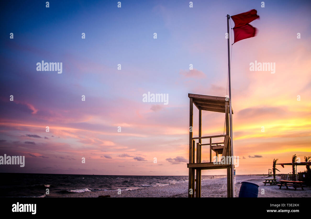 Double flags warn swimmers of the potential for rip currents as a storm approaches Dauphin Island, Alabama. Stock Photo