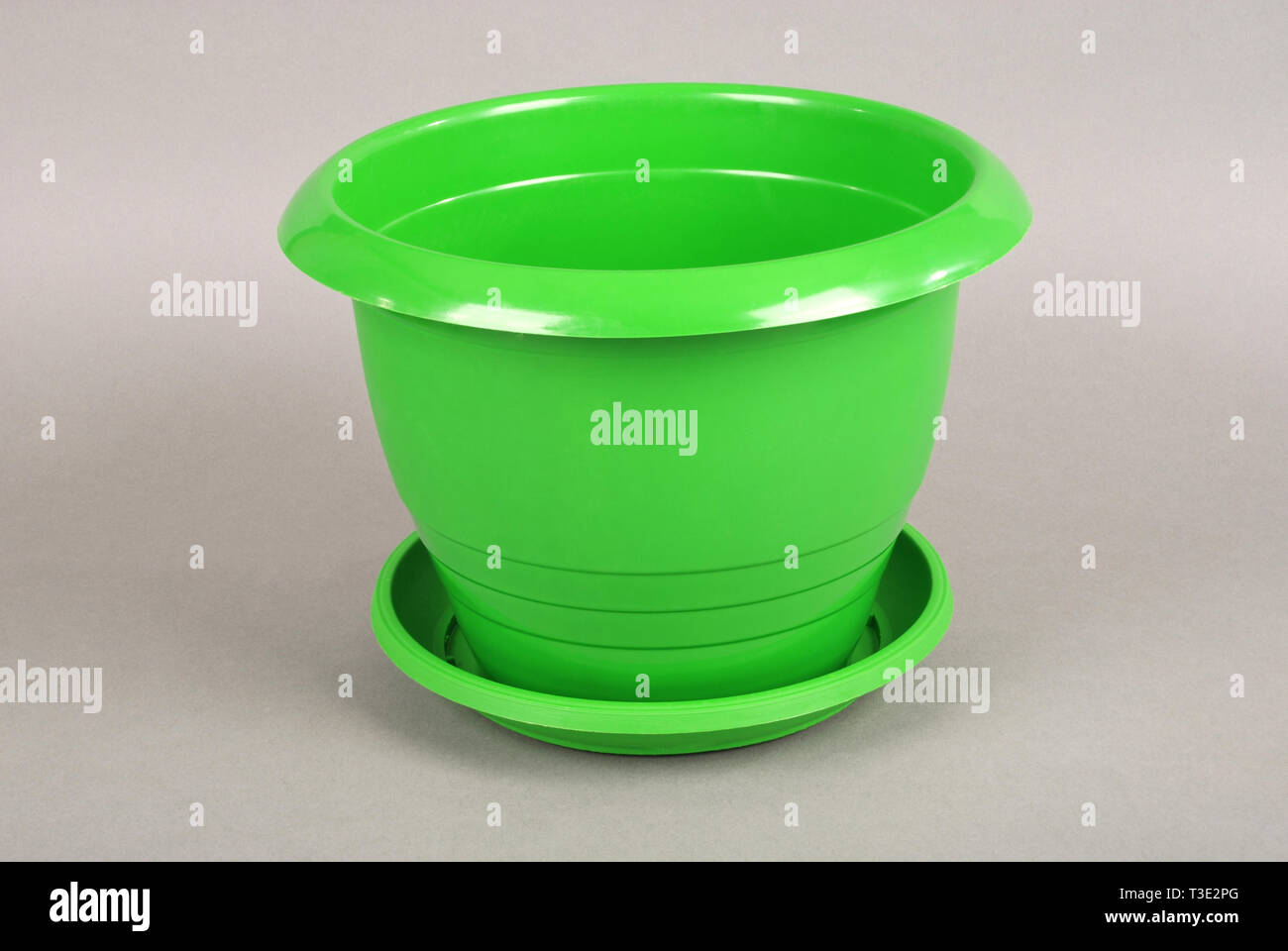 Green Plastic Flower Pots on Grey Background Stock Photo Alamy