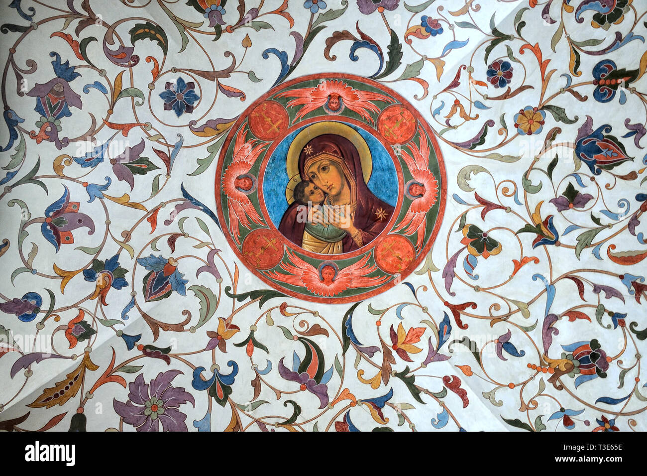 = Medallion Our Lady with Son and Floral Ornaments =  Interior ceiling in the ground level of St. Basil’s Cathedral with restored 17th century murals, Stock Photo