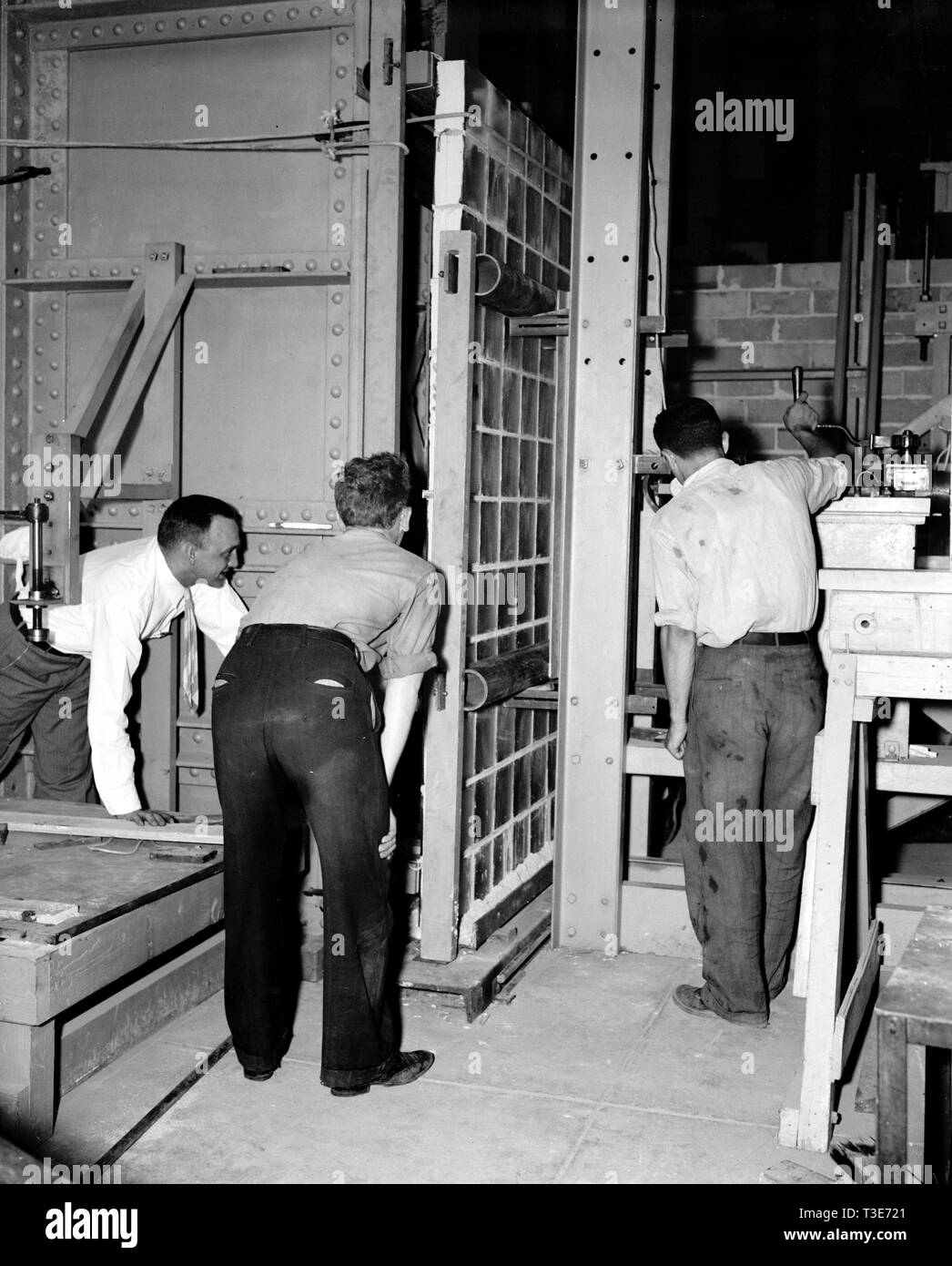 Testing strength of glass panels hires stock photography and images