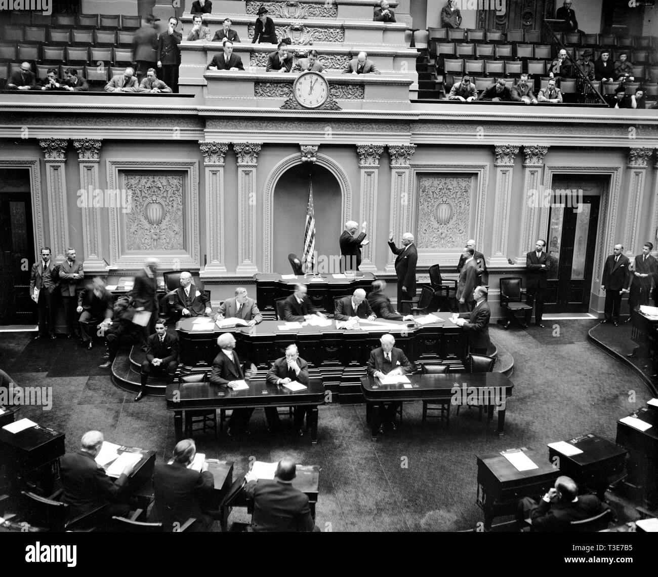 Scene in the United States Senate as Vice President Garner administers the oath to Senator Elmer Thomas, re-elected from Oklahoma in last November's election ca. 1/4/1939 Stock Photo