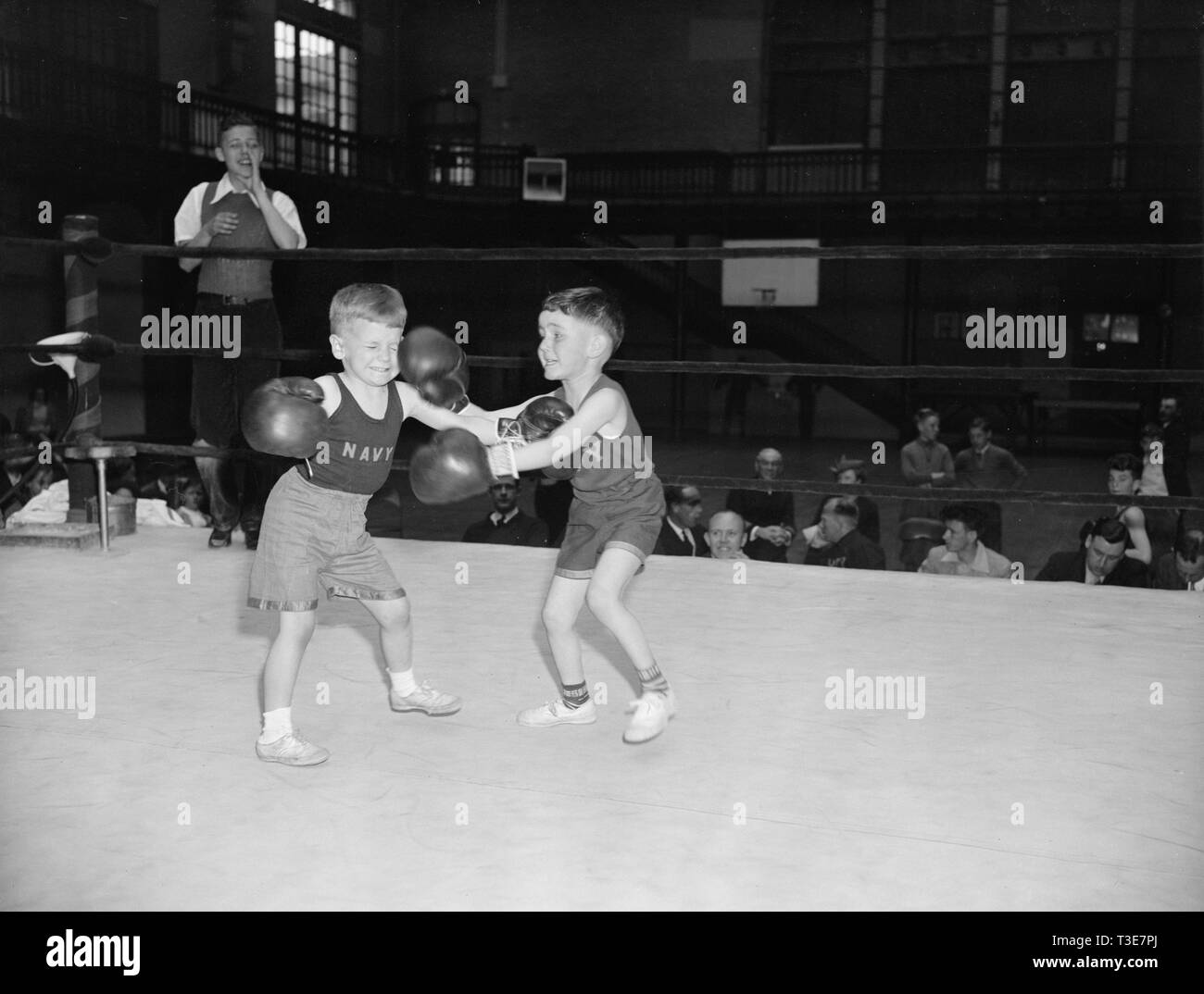 This 20th annual tournament was entered by more than 100 lads ranging from 3 to 14 years. Here are two six year old 50-bounders exchanging blows Stock Photo