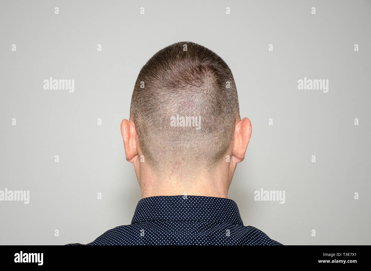 Back View Portrait Of A Bearded Middle Aged Man In Stylish Dark