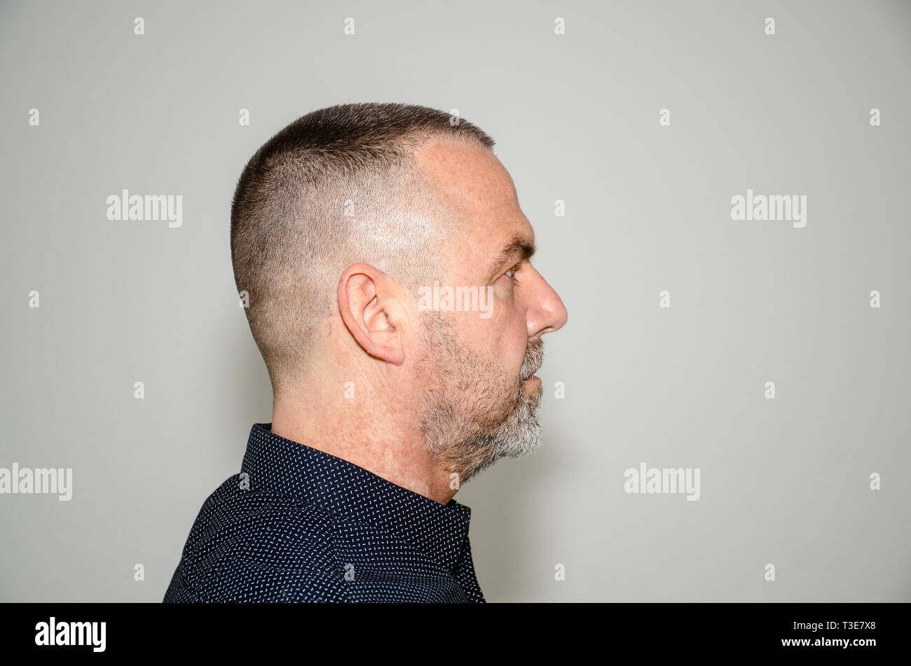 Profile Portrait Of A Bearded Middle Aged Man In Stylish Dark