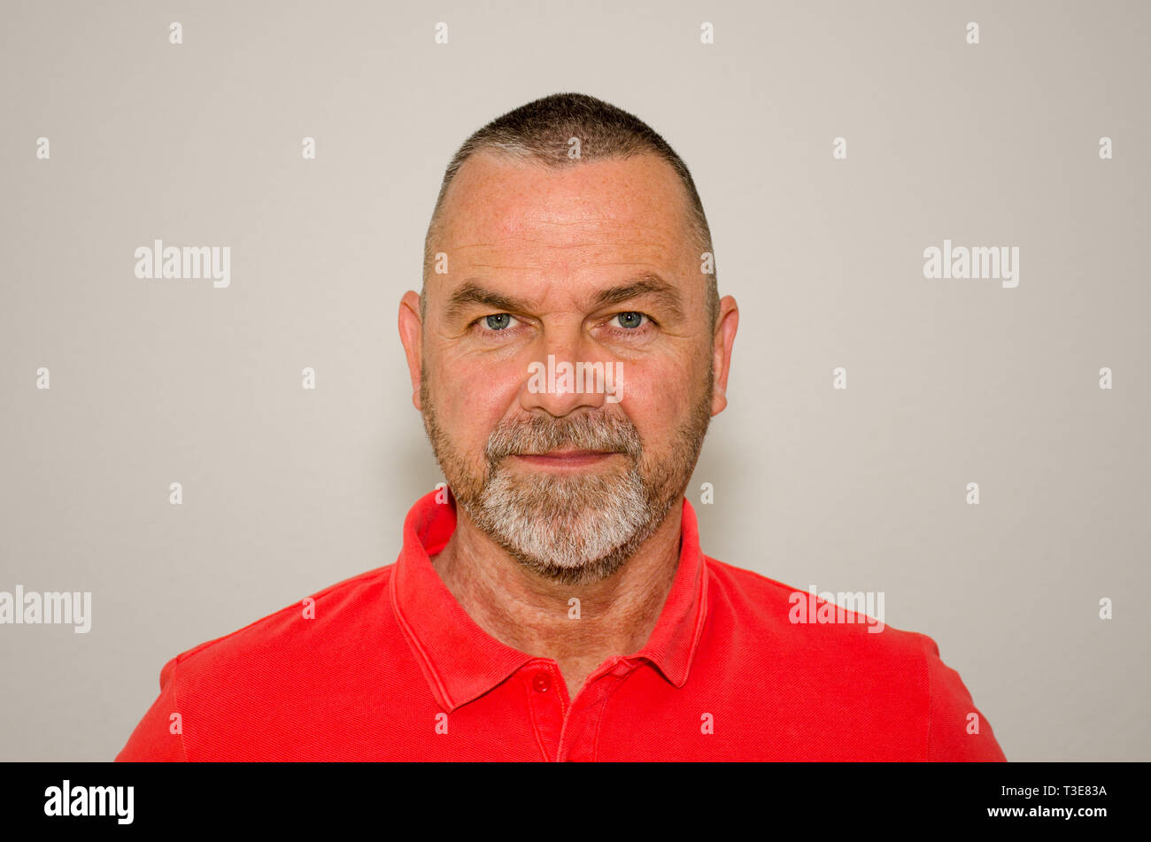 Friendly Bearded Middle Aged Man With Short Modern Haircut Wearing