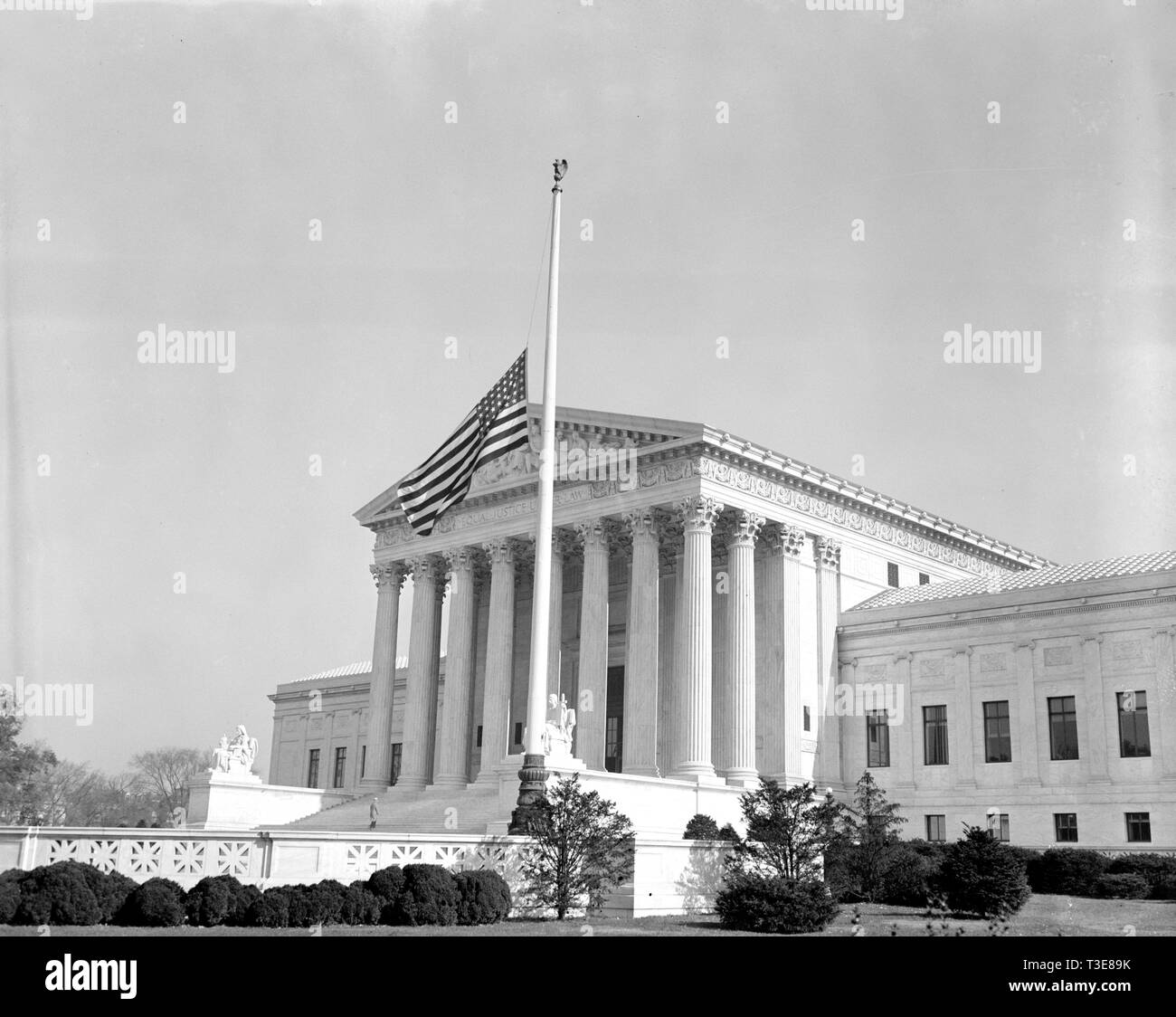 The flags in front of the United States Supreme Court were lowered to half-mast today out of respect to Associate Justice Pierce Butler ca. November 1939 Stock Photo