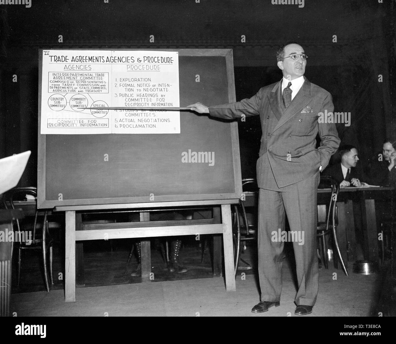 Man pointing to chart in presentation about trade agreements ca. 1939 or 1940 Stock Photo