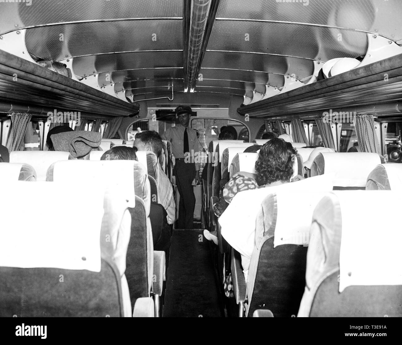 Bus passengers inside a Greyhound bus ca. 1937 Stock Photo