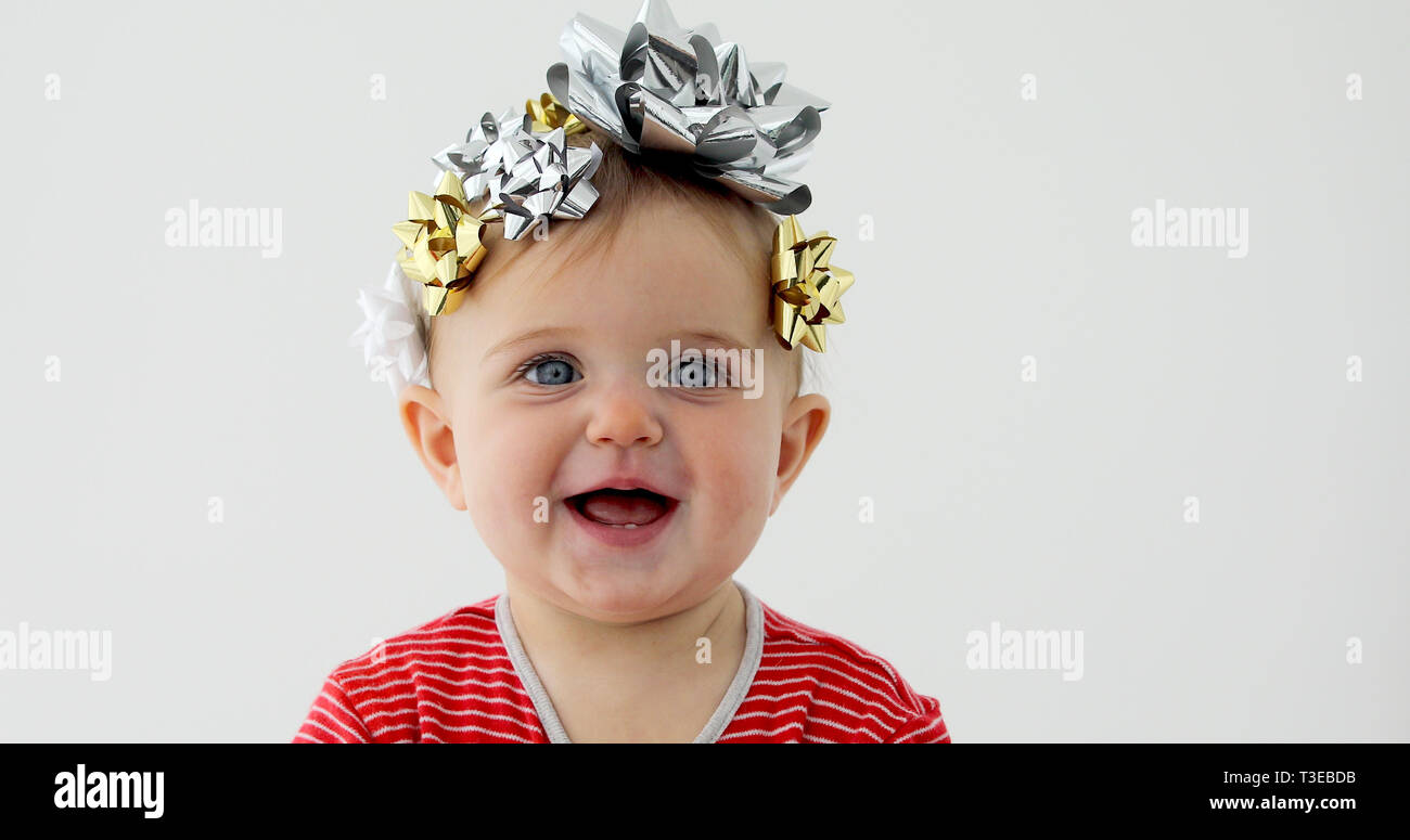 Baby decorated with a bow as a gift Stock Photo