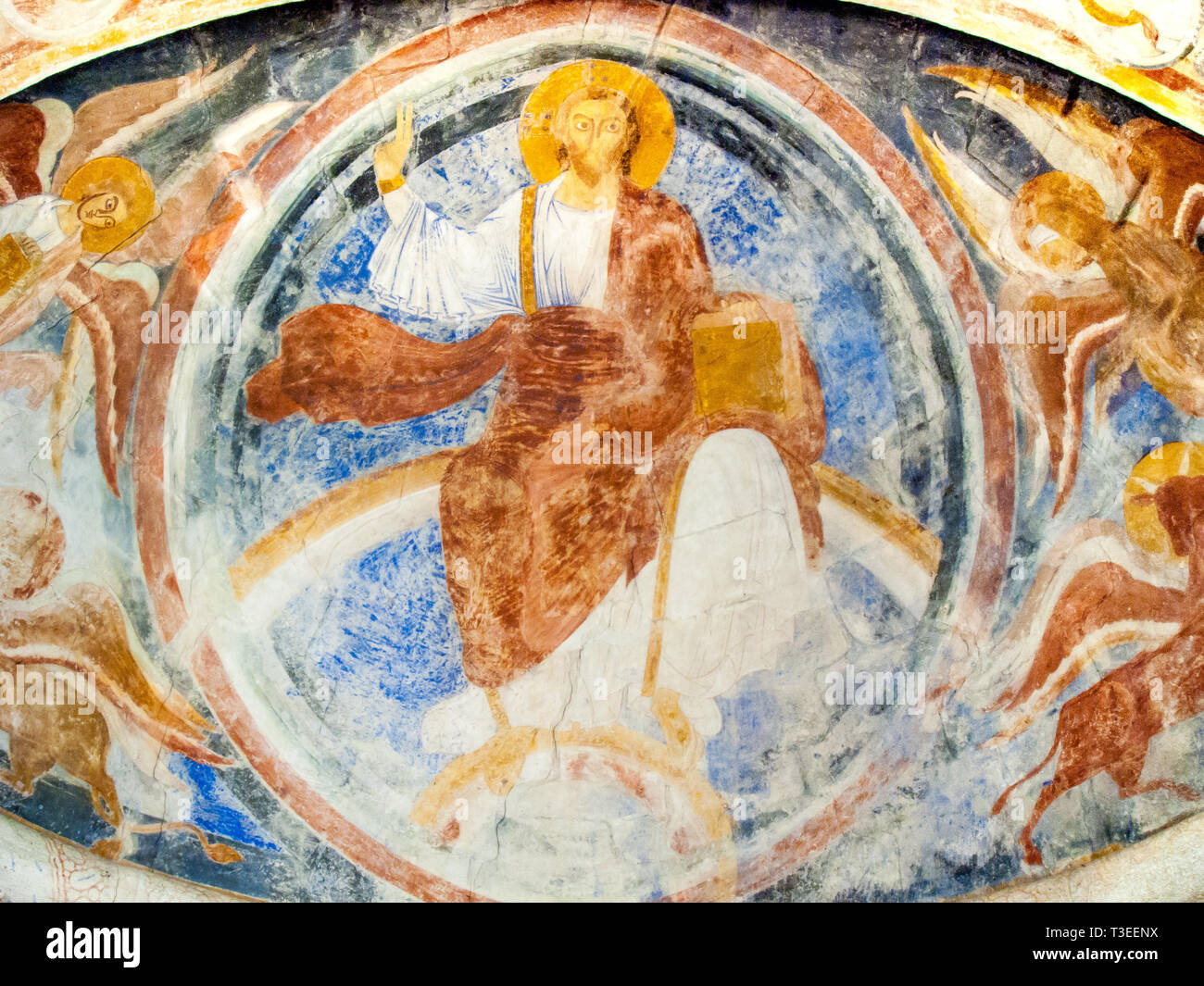 Christ sitting on his trone with the four evangelists, a romanesque wall-painting from 1121, Va church , Sweden - October 9, 2009 Stock Photo