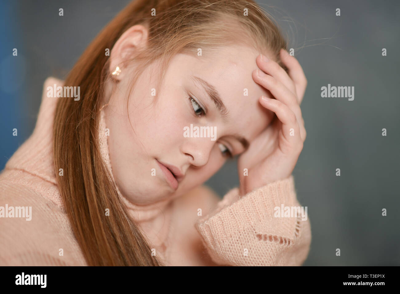 Close up portrait of sad sick girl suffering from illness Stock Photo