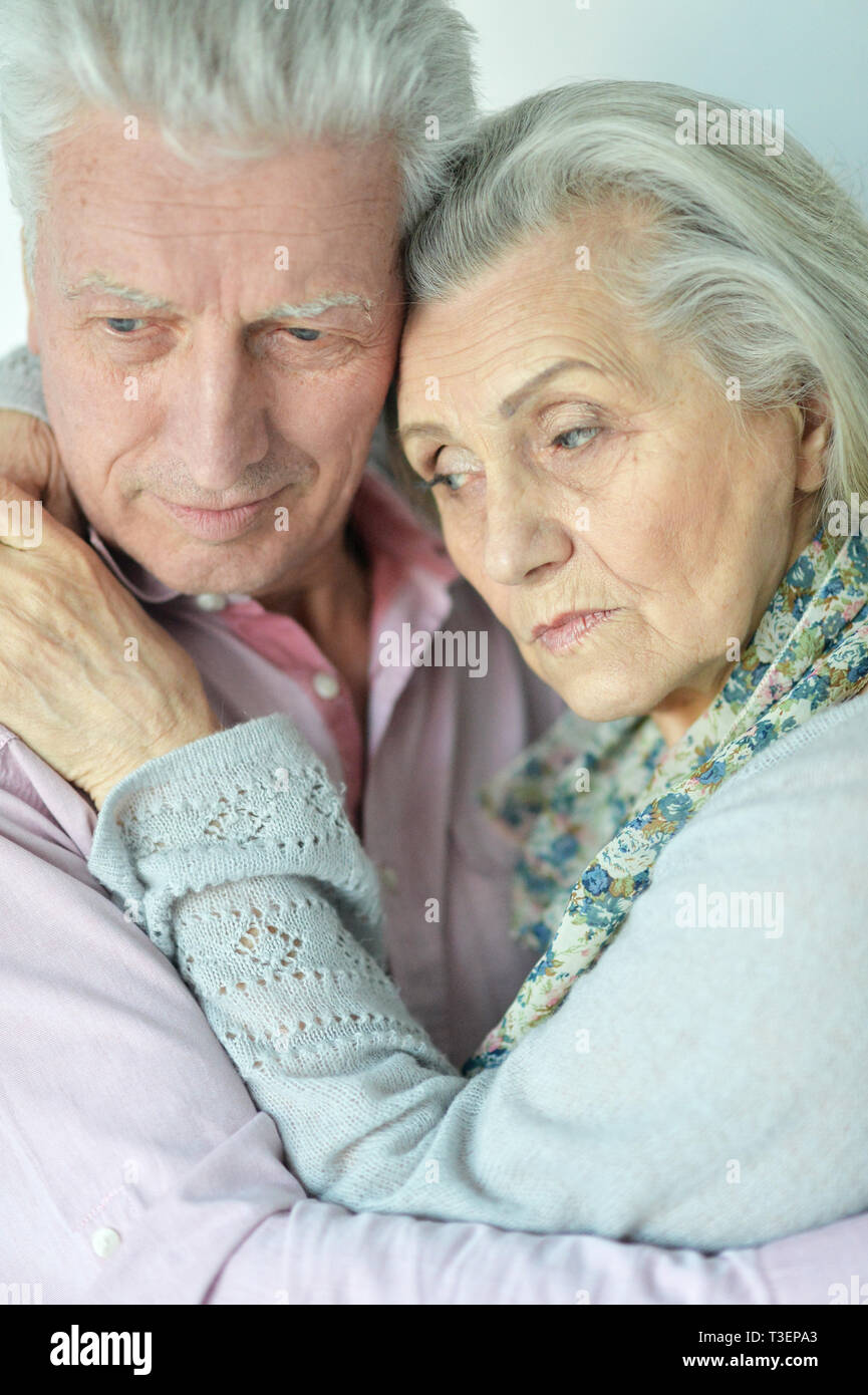 Close up portrait of sad senior couple posing at home Stock Photo