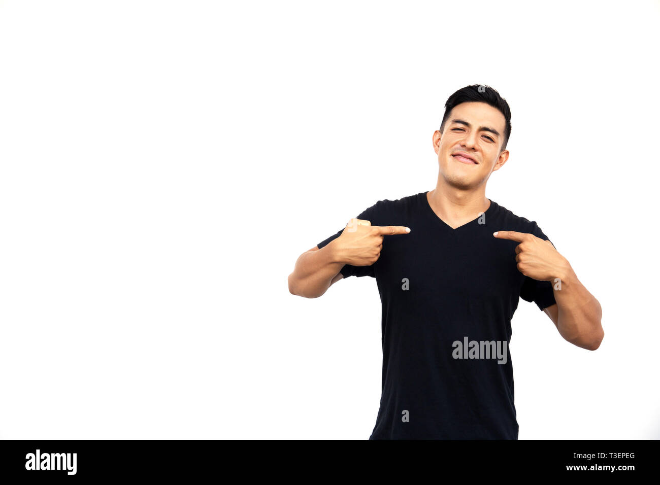 Handsome latin hispanic man is pointing himself isolated on white background. Place for text. Stock Photo
