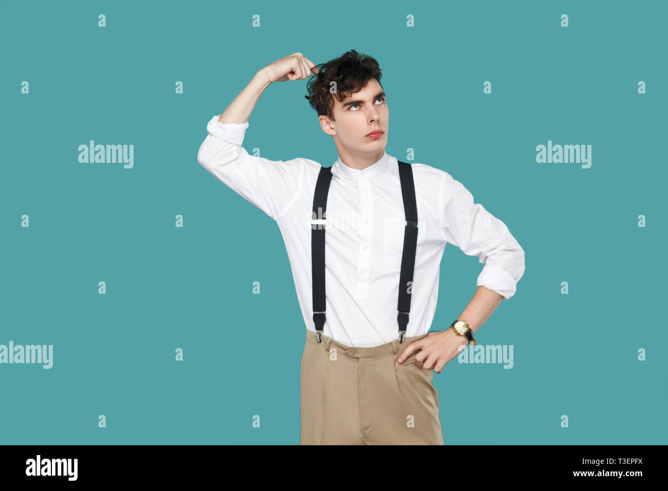 Confused man looking away and thinking. Portrait of handsome hipster ...