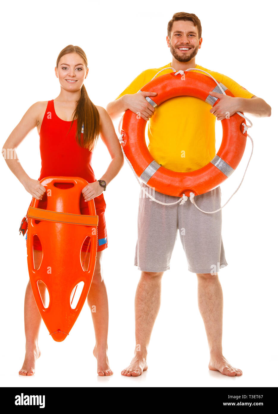 Lifeguards with rescue tube and ring buoy lifebuoy. Man and woman