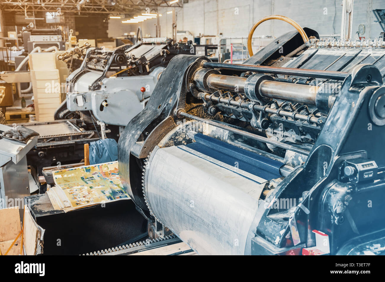 Old vintage printing machine for cutting cardboard in printing house