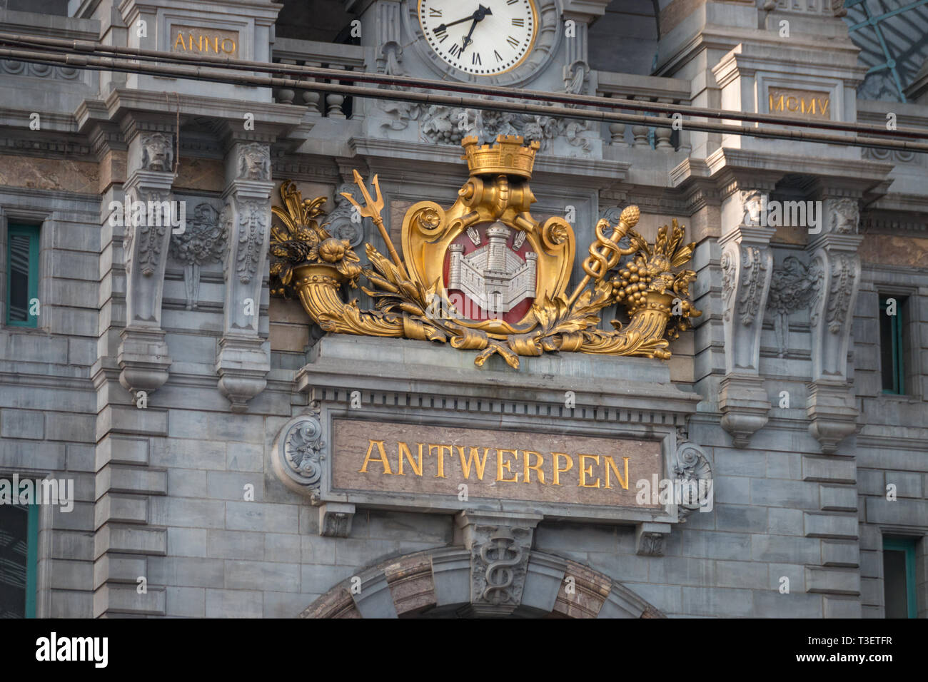 Clock and “Antwerpen” lettering inside Antwerpen-Centraal (Antwerp Central) railway station in the Belgian city of Antwerp Stock Photo