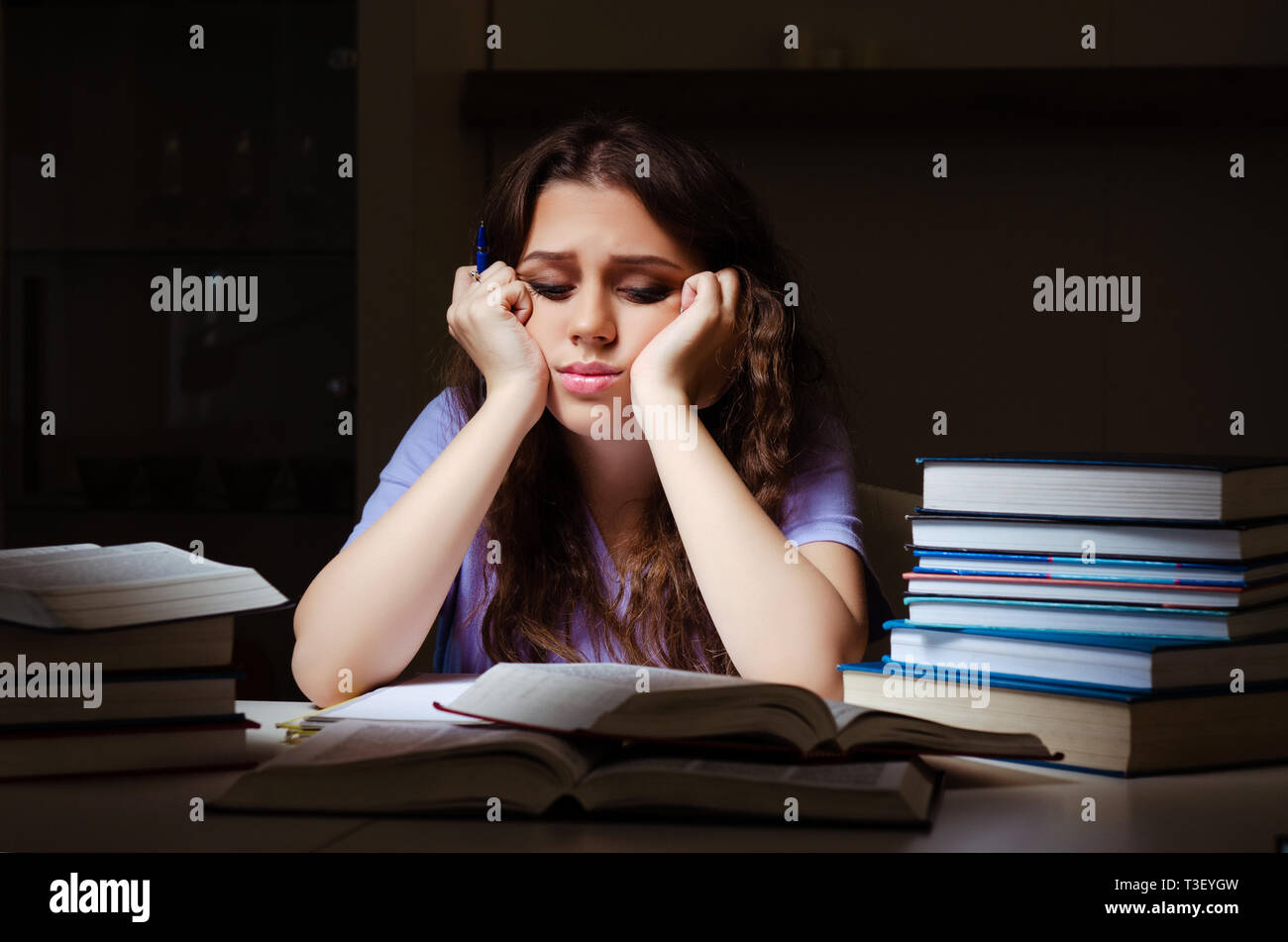 Young female student preparing for exams late at home Stock Photo - Alamy