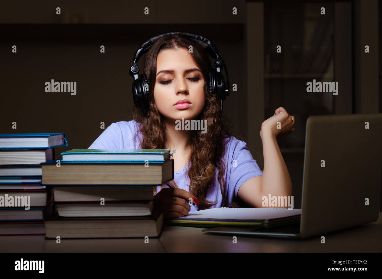 Young female student preparing for exams late at home Stock Photo - Alamy