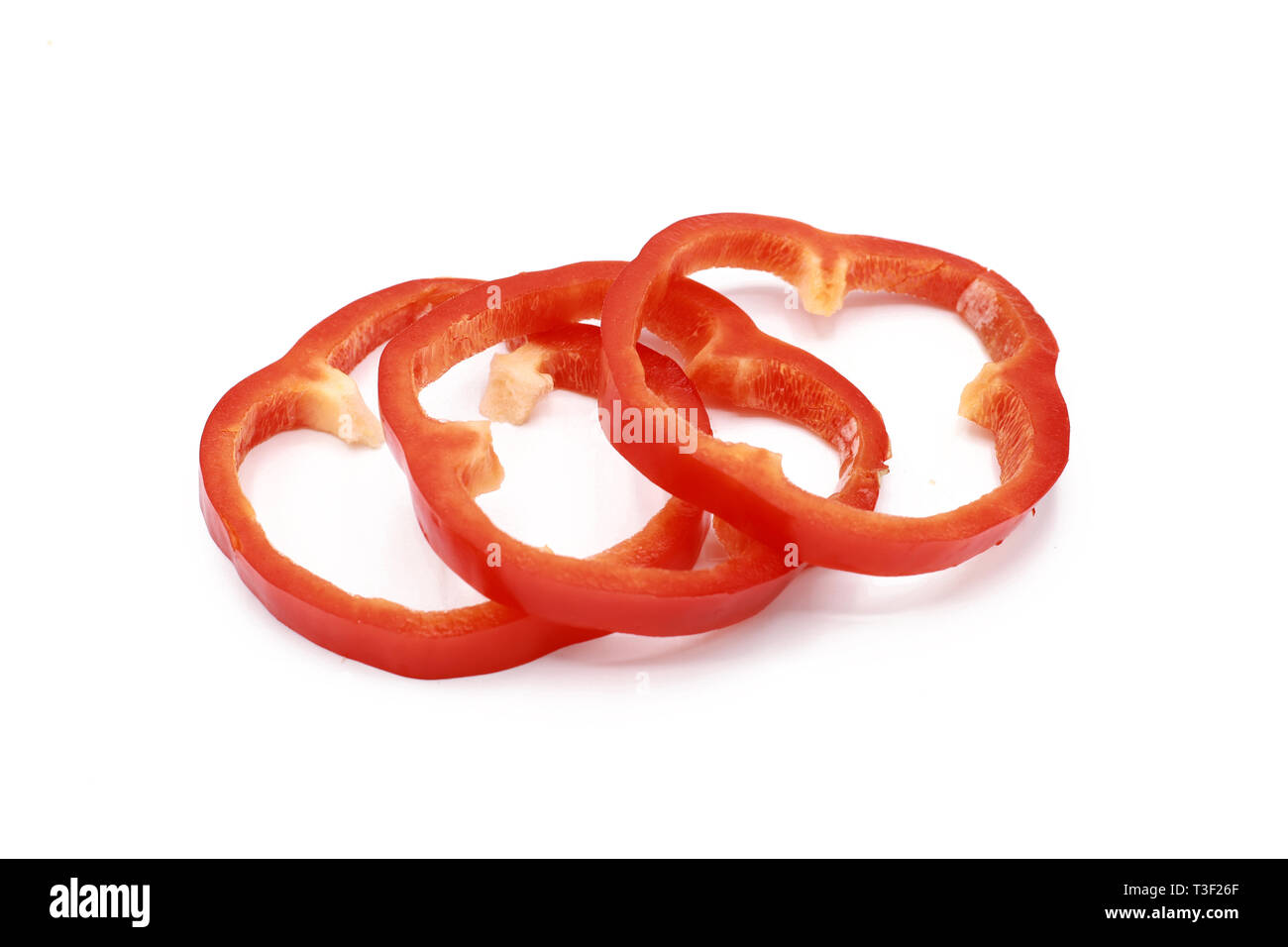 sliced sweet red pepper rings - isolated on white Stock Photo