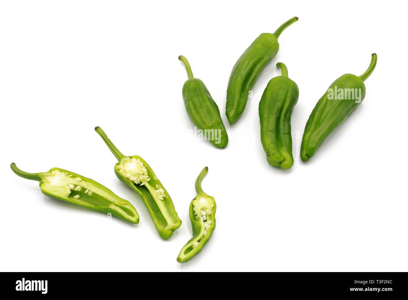 chilli pod set of fresh whole and chopped fresh green chili peppers