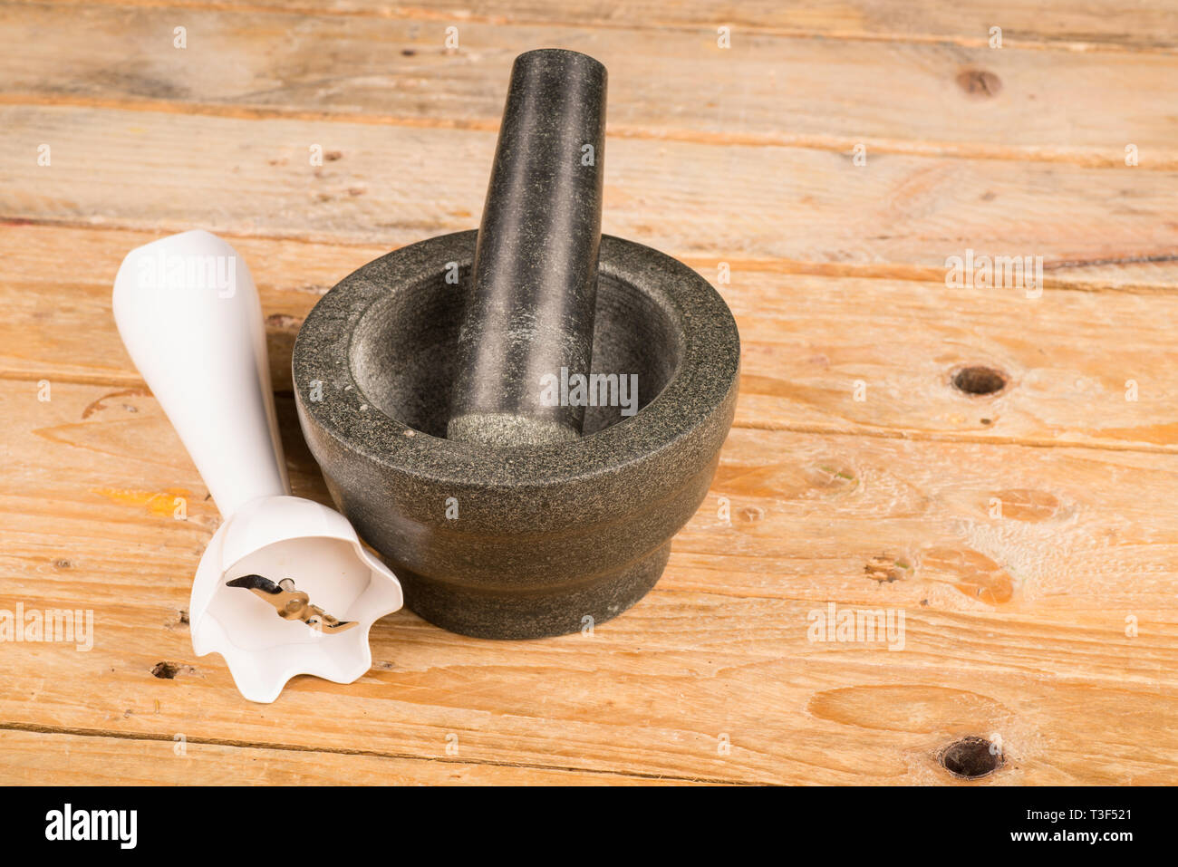 Heavy stone mortar and pestle vs modern blender, an old vs new concept