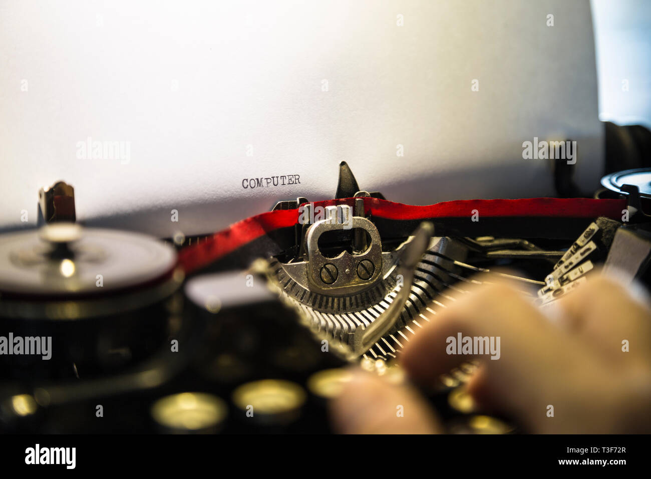 Historical typewriter with hand typing Stock Photo Alamy