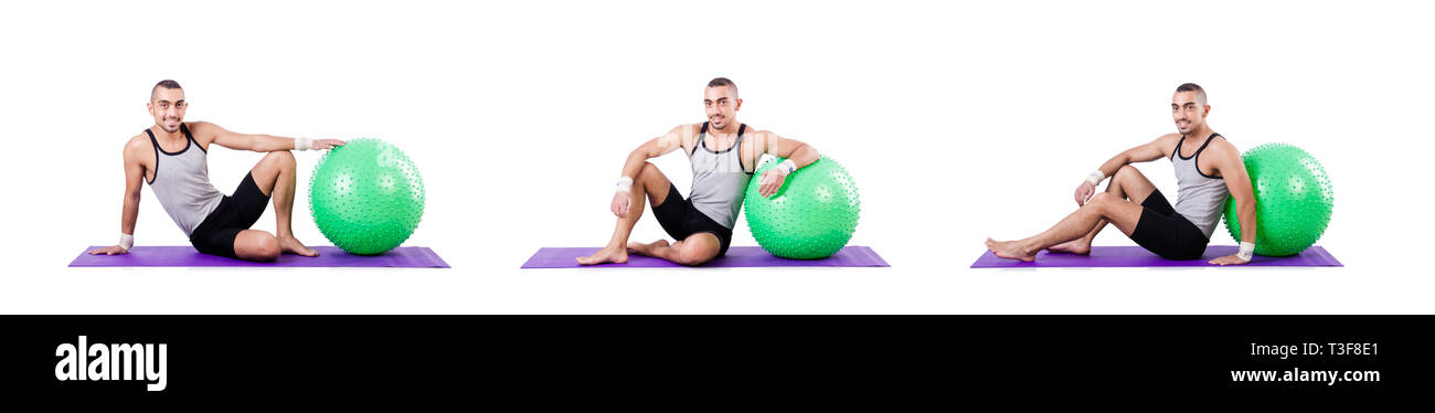 Man with swiss ball doing exercises on white Stock Photo - Alamy